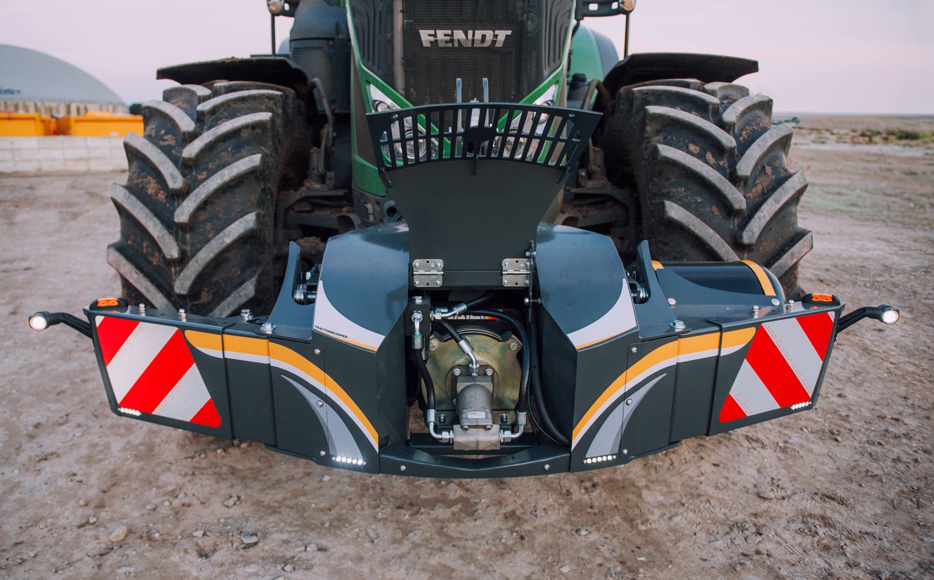 Tractor bumper with compressor