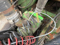 Hooked-arm carrier Joskin Cargo chassis met tank en Drakkar bak