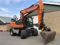 Excavator Doosan DX140w-5 met draaikantelstuk egcon