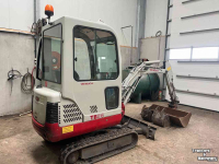 Excavator tracks Takeuchi TB016 met machinetrailer