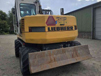Excavator mobile Liebherr 312 banden kraan graafmachine
