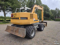 Excavator mobile Liebherr 312 banden kraan graafmachine