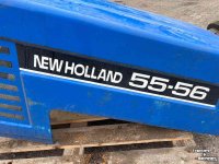 Used parts for tractors New Holland 55-56 motorkap + delen gebruikt