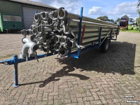Irrigation pipes  Kar met 64 dikke aanvoer buizen