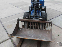 Wheelloader Giant D204SW minishovel wiellader puinriek en palletvork