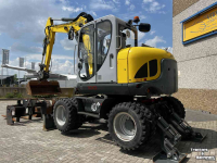 Excavator mobile Wacker Neuson EW 100 Airco Powertilt 3 Bakken Palletvork  Steunpoten