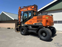 Excavator mobile Doosan DX140w-5 met draaikantelstuk
