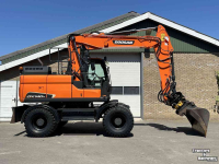 Excavator mobile Doosan DX140w-5 met draaikantelstuk